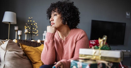 sad woman with Christmas presents