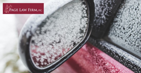 snow on car side mirror