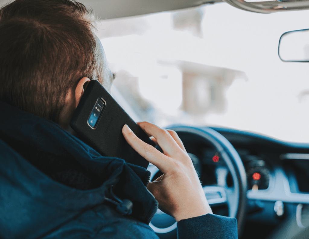 Man talks on the phone in the car