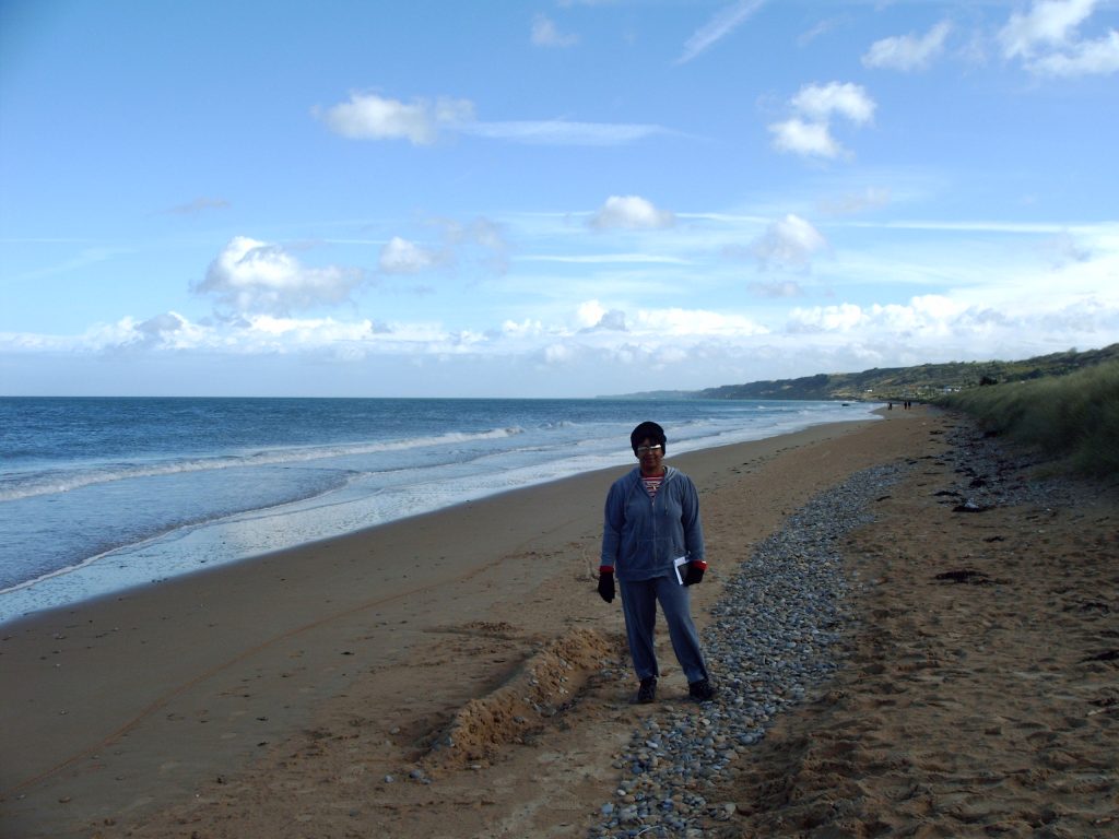 Attorney Page stands on Omaha Beach